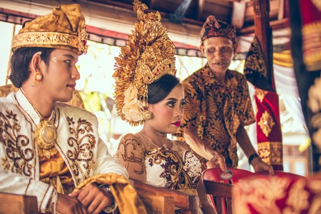 BALI, INDONESIA - APRIL 13, 2018: Newlyweds on balinese wedding ceremony. Traditional wedding.のeditorial素材