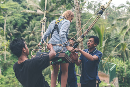 BALI, INDONESIA - JANUARY 23, 2018: Woman swings in the deep jungle. Bali island.