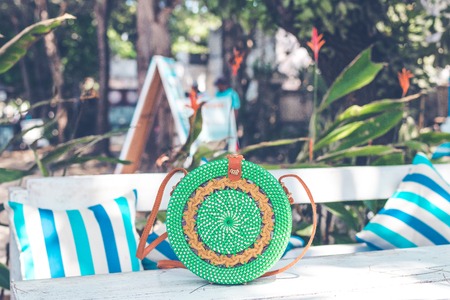 Handmade natural organic rattan handbag. Tropical island of Bali. Eco-bag concept. Ecobags from Bali.の写真素材