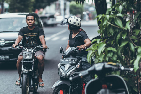 BALI, INDONESIA - MAY 17, 2018: : Road traffic on Bali. Ubud area. Mopeds on the streets....