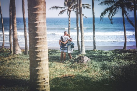 Young couple among palms on the tropical island of Bali.の写真素材