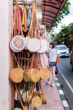 Stylish rattan handbags on the balinese street in Ubud.の写真素材