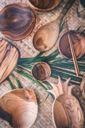 Wooden tableware. Pure teak wood. Dinnerware, kitchenware from Indonesia. Bali islandの写真素材