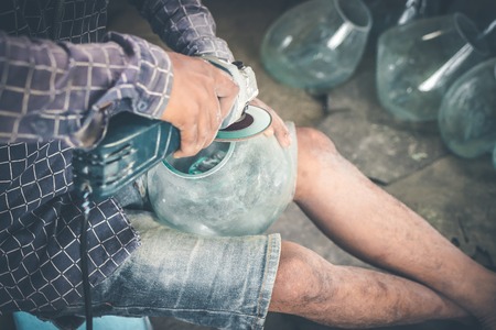 Close-up of a male mechanic with glass polish machine.の写真素材