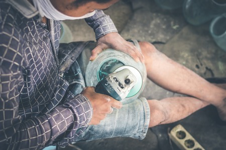 Close-up of a male mechanic with glass polish machine.の写真素材