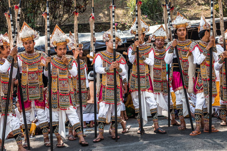BALI, INDONESIA - SEPTEMBER 25, 2018: Balinese men in traditional clothes on a big ceremony in Tirta...