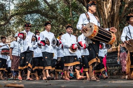BALI, INDONESIA - SEPTEMBER 25, 2018: Balinese men in traditional clothes on a big ceremony in Tirta Empul Temple.のeditorial素材