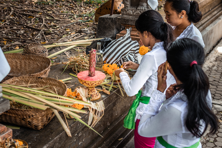 BALI, INDONESIA - SEPTEMBER 25, 2018: Balinese women in traditional clothes on a big ceremony in famous Tirta Empul Temple.のeditorial素材