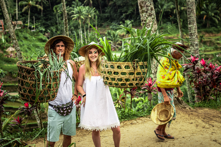 BALI, INDONESIA - AUGUST 24, 2018: Young honeymoon couple on rice fields of Bali island. Travel vacation on Bali concept.のeditorial素材