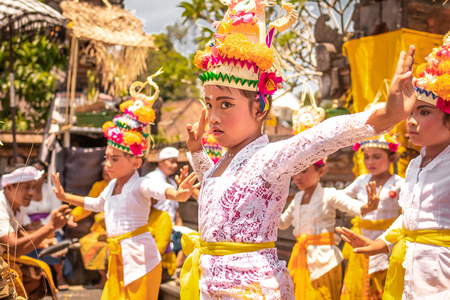 BALI, INDONESIA - OCTOBER 3, 2018: Balinese girls dancing in traditional costume on a balinese family ceremony in desa Pejeng Kangi.のeditorial素材