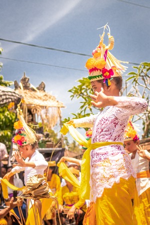 BALI, INDONESIA - OCTOBER 3, 2018: Balinese girls dancing in traditional costume on a balinese family ceremony in desa Pejeng Kangi.のeditorial素材