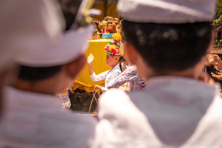 BALI, INDONESIA - OCTOBER 3, 2018: Balinese girls dancing in traditional costume on a balinese family ceremony in desa Pejeng Kangi.のeditorial素材