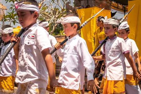 BALI, INDONESIA - OCTOBER 3, 2018: Balinese boys ritual dance in traditional costume on a balinese family ceremony in desa Pejeng Kangi.のeditorial素材