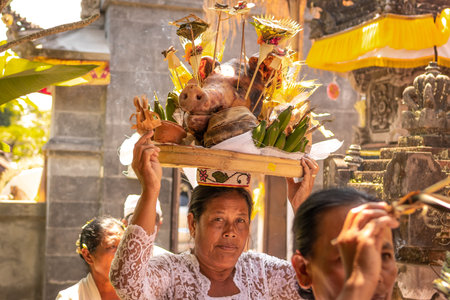 BALI, INDONESIA - OCTOBER 3, 2018: Balinese woman in traditional clothes on village ceremony....