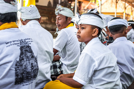 BALI, INDONESIA - OCTOBER 9, 2018: Balinese boy in traditional clothes on culture ceremony, Ubud, Gianyar.のeditorial素材