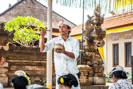 BALI, INDONESIA - OCTOBER 9, 2018: Holyman on a traitional balinese hindu ceremony in Ubud.のeditorial素材