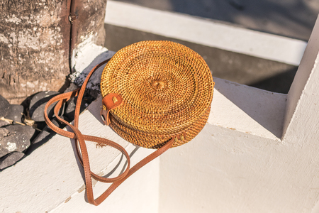 Nude natural organic handmade rattan handbag closeup. Sea concept. Summer style.の写真素材