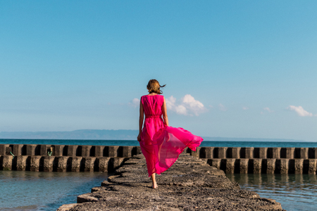 Young woman on a tropical beach of Bali island. Indonesia.の写真素材