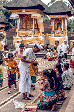 BALI, INDONESIA - DECEMBER 26, 2018: People praying on a traditional balinese ceremony.のeditorial素材