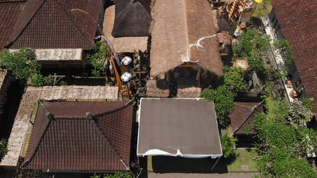 4K aerial view of traditional balinese houses. Flying over balinese village. Bali island.の写真素材