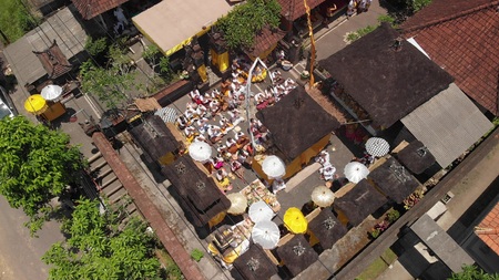 Aerial view of family balinese ceremony in a small village close to Ubud area. Hindu traditional ceremony.の写真素材