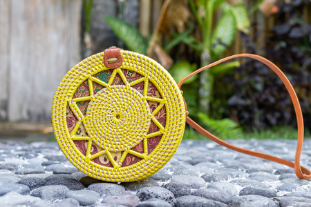Fashion organic handmade rattan bag on a tropical background. Bali island.の写真素材