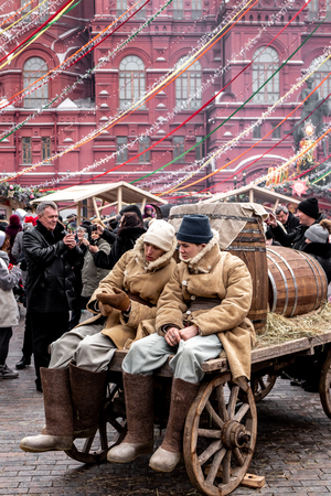 Moscow, RUSSIA - MARCH 10, 2019: Two men in traditional russian clothes on a Red Square during pancake week at Russia, Moscow.のeditorial素材