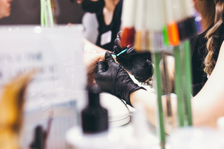 Master of manicure in work progress. Beauty salon. Hand treatment concept.の写真素材
