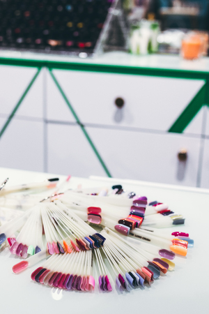 Nails samples palette in beauty salon. Nail design. Fashion concept. Beauty concept.の写真素材