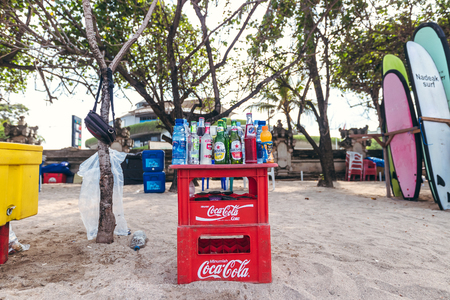 BALI, INDONESIA - FEBRUARY 19, 2019: Coca cola boxes and bintang beer on the Kuta Beach.のeditorial素材