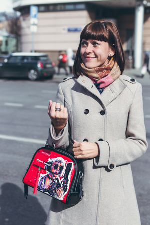 MOSCOW, RUSSIA - APRIL 5, 2019: Young woman with super fashion stylish hand painted bag on the street.のeditorial素材