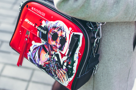 MOSCOW, RUSSIA - APRIL 5, 2019: Young woman with super fashion stylish hand painted bag on the street.のeditorial素材