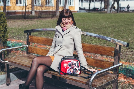 MOSCOW, RUSSIA - APRIL 5, 2019: Young woman with super fashion stylish hand painted bag on the street.のeditorial素材