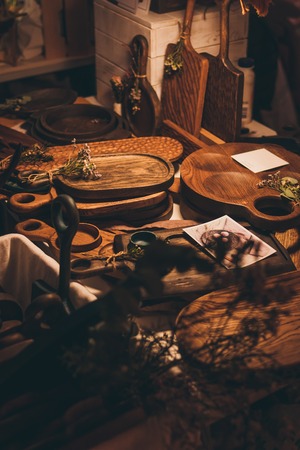 Handmade cutting boards and vintage wooden dishes. Wooden kitchenware. Cooking dishes.の写真素材