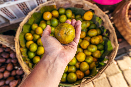 Fresh mandarins on a local organic food market. Bali island, Indonesia. Asia.