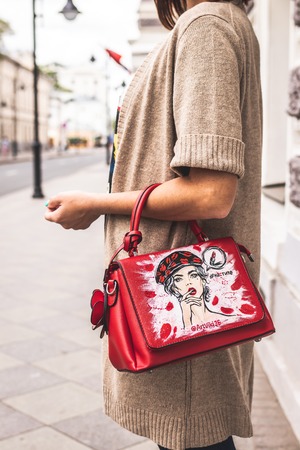 MOSCOW, RUSSIA - MAY 12, 2019: Woman with hand painted bag outdoors.のeditorial素材
