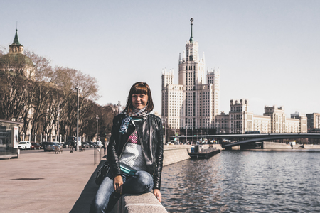 MOSCOW, RUSSIA - MAY 19, 2019: Young woman on Kotelnicheskaya Embankment. Moscow, Russia. Cityscape.のeditorial素材