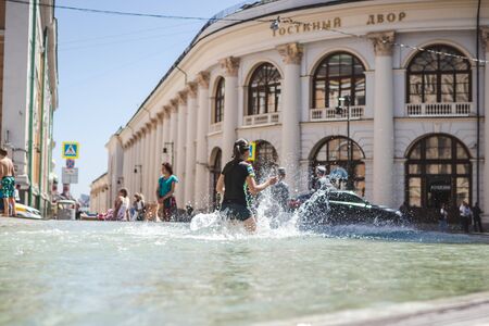 MOSCOW, RUSSIA - JUNE 5, 2019: Children having fun in city fountain.のeditorial素材