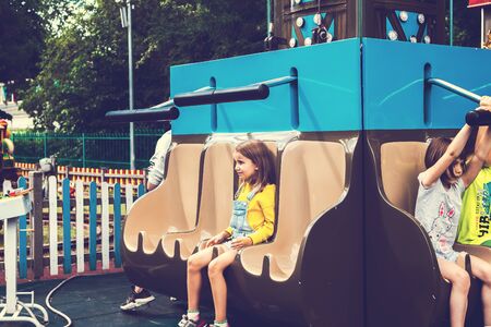 MOSCOW, RUSSIA - JUNE 2, 2019: Kids at amusement park.のeditorial素材