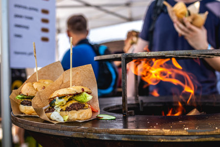 Hamburger on a Hot Flaming BBQ Grill. Barbeque burger. Tasty burger.の写真素材