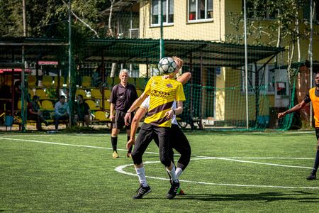MOSCOW, RUSSIA - AUGUST 24, 2019: Soccer players in game. Amateur league in Moscow.のeditorial素材