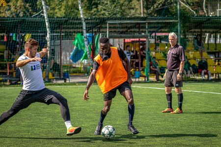 MOSCOW, RUSSIA - AUGUST 24, 2019: Soccer players in game. Amateur league in Moscow.のeditorial素材