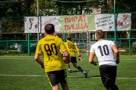 MOSCOW, RUSSIA - AUGUST 24, 2019: Soccer players in game. Amateur league in Moscow.のeditorial素材