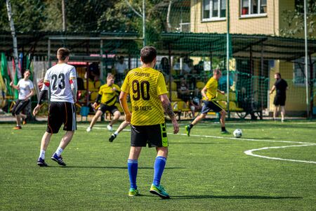 MOSCOW, RUSSIA - AUGUST 24, 2019: Soccer players in game. Amateur league in Russia.のeditorial素材