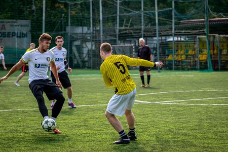 MOSCOW, RUSSIA - AUGUST 24, 2019: Soccer players in game. Amateur league in Russia.のeditorial素材