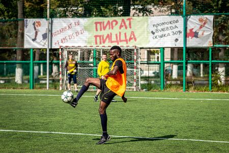 MOSCOW, RUSSIA - AUGUST 24, 2019: Soccer players in game. Amateur league in Russia.のeditorial素材