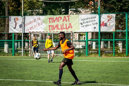 MOSCOW, RUSSIA - AUGUST 24, 2019: Soccer players in game. Amateur league in Russia.のeditorial素材