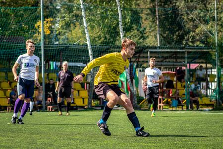 MOSCOW, RUSSIA - AUGUST 24, 2019: Soccer players in game. Amateur league in Russia.のeditorial素材