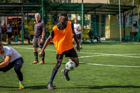 MOSCOW, RUSSIA - AUGUST 24, 2019: Soccer players in game. Amateur league in Moscow.のeditorial素材