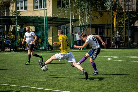 MOSCOW, RUSSIA - AUGUST 24, 2019: Soccer players in game. Amateur league in Moscow.のeditorial素材